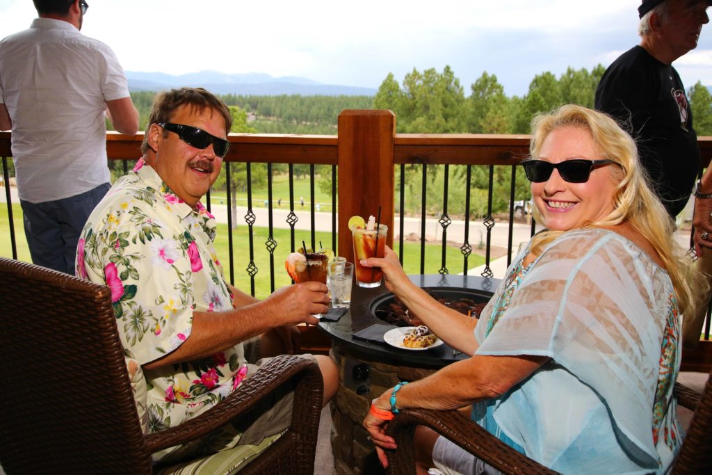 Two people enjoy Bloody Marys at the Bloody Good Bacon Brunch