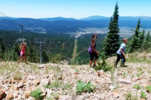 Family hiking at summit on a sunny day